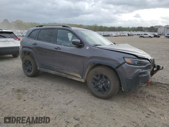 2021 Jeep Cherokee Trailhawk with VIN 1C4PJMBX7MD215581, listed as a Copart auction lot 51281205 with 62,199 mi miles and Salvage title. Bid and sale history available at DreamBid. Image 4.