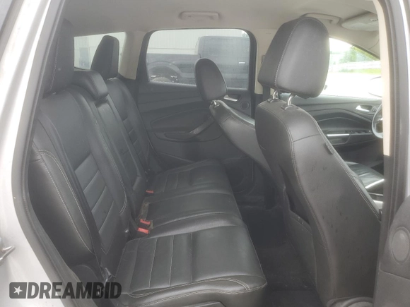 2013 Ford Escape SEL z VIN 1FMCU9H9XDUD00146, wystawiony jako Copart lot #60886165 z przebiegiem 198 557 mil mil oraz Szkoda całkowita • Salvage title. Historia ofert i sprzedaży dostępna na DreamBid. Obrazek 11.