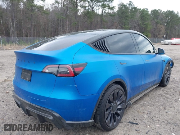 2021 Tesla Model Y Performance z VIN 5YJYGDEF8MF209819, wystawiony jako IAAI lot #41757009 z przebiegiem 37 685 mil mil oraz . Historia ofert i sprzedaży dostępna na DreamBid. Obrazek 4.