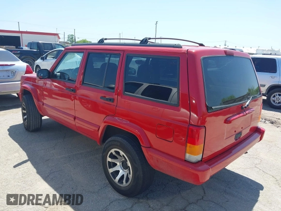 1998 Jeep Cherokee Sport with VIN 1J4FT68S2WL256846, listed as a IAAI auction lot 41998490 with 198,936 mi miles. Bid and sale history available at carsss.com. Image 3.