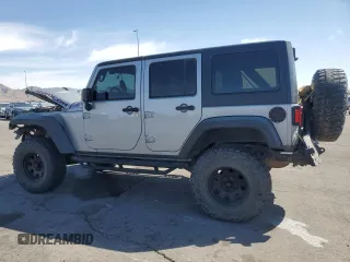 2014 Jeep Wrangler Unlimited Rubicon X with VIN 1C4BJWFG2EL308077, listed as a Copart auction lot 54439265 with 160,746 mi miles and Salvage title. Bid and sale history available at DreamBid. Image 2.