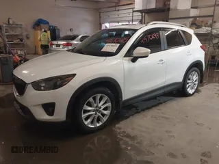 2013 Mazda CX-5 Grand Touring with VIN JM3KE4DE8D0147851, listed as a IAAI auction lot 41570695 with 94,648 mi miles. Bid and sale history available at carsss.com. Image 2.
