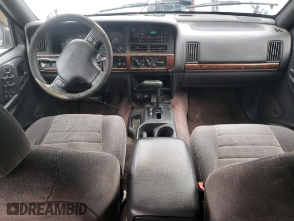 1996 Jeep Grand Cherokee Laredo with VIN 1J4FX58S5TC248122, listed as a Copart auction lot 45843935 with 295,521 mi miles and Salvage Title. Bid and sale history available at carsss.com. Image 8.