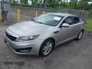 2013 Kia Optima EX z VIN 5XXGN4A70DG251141, wystawiony jako IAAI lot #42410478 z przebiegiem 245 963 mil mil oraz . Historia ofert i sprzedaży dostępna na DreamBid. Obrazek 2.