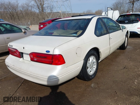 1996 Ford Thunderbird LX z VIN 1FALP6240TH131517, wystawiony jako IAAI lot #41811552 z przebiegiem 87 493 mil mil oraz . Historia ofert i sprzedaży dostępna na DreamBid. Obrazek 4.