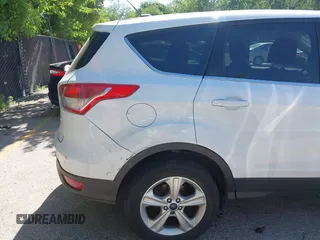 2016 Ford Escape SE z VIN 1FMCU9GX1GUC67851, wystawiony jako IAAI lot #42283011 z przebiegiem 134 458 mil mil oraz . Historia ofert i sprzedaży dostępna na DreamBid. Obrazek 6.