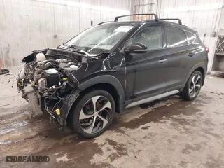 2018 Hyundai Tucson Value with VIN KM8J3CA28JU648236, listed as a IAAI auction lot 41161221 with 104,057 mi miles. Bid and sale history available at carsss.com. Image 18.