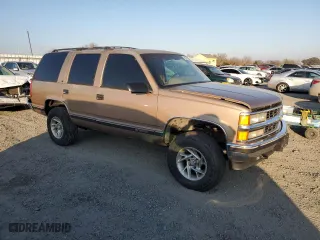 1996 Chevrolet Tahoe with VIN 1GNEK13R2TJ354351, listed as a Copart auction lot 43276385 with 2,526,567 mi miles and Salvage Title. Bid and sale history available at carsss.com. Image 4.