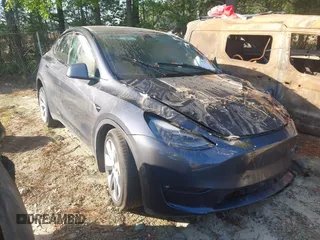 2023 Tesla Model Y Long Range with VIN 7SAYGDEE1PF647841, listed as a IAAI auction lot 41156390 with 33,473 mi miles. Bid and sale history available at carsss.com. Image 1.