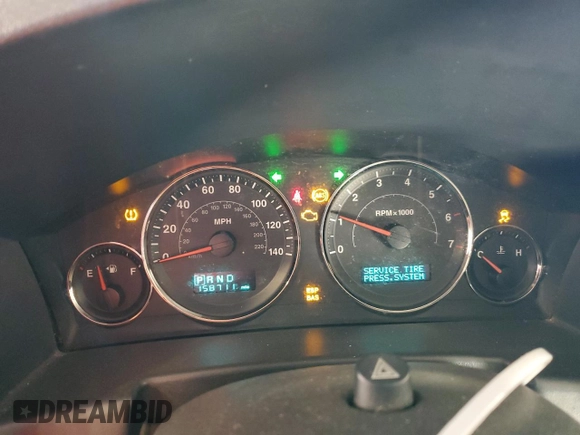 2006 Jeep Commander Limited z VIN 1J8HG58N86C305693, wystawiony jako Copart lot #80289634 z przebiegiem 158 711 mil mil oraz Szkoda całkowita • Salvage title. Historia ofert i sprzedaży dostępna na DreamBid. Obrazek 9.
