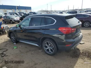 2018 BMW X1 xDrive28i with VIN WBXHT3C31J5K25021, listed as a Copart auction lot 48779555 with 71,741 mi miles and Salvage Title. Bid and sale history available at carsss.com. Image 2.