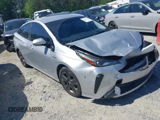 2020 Toyota Prius L Eco z VIN JTDKARFUXL3125434, wystawiony jako IAAI lot #42201623 z przebiegiem 58 609 mil mil oraz . Historia ofert i sprzedaży dostępna na DreamBid. Obrazek 1.