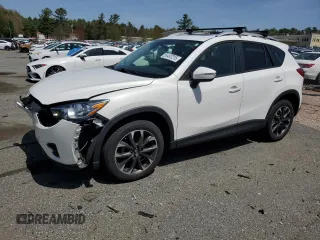 2016 Mazda CX-5 Grand Touring z VIN JM3KE4DY1G0758433, wystawiony jako Copart lot #54497215 z przebiegiem 127 025 mil mil oraz Szkoda całkowita • Salvage title. Historia ofert i sprzedaży dostępna na DreamBid. Obrazek 1.