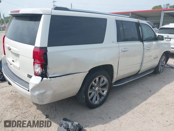 2015 Chevrolet Suburban LTZ with VIN 1GNSCKKC5FR740352, listed as a IAAI auction lot 39075234 with 112,945 mi miles and . Bid and sale history available at DreamBid. Image 4.
