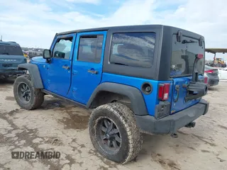2015 Jeep Wrangler Unlimited Rubicon with VIN 1C4BJWFG5FL558348, listed as a IAAI auction lot 41460025 with 106,012 mi miles. Bid and sale history available at carsss.com. Image 3.