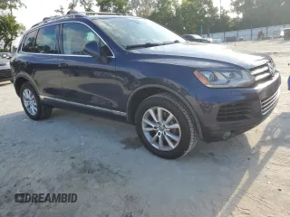 2014 Volkswagen Touareg Sport with VIN WVGEF9BP0ED005648, listed as a Copart auction lot 53230315 with 188,103 mi miles and Clean Title. Bid and sale history available at DreamBid. Image 4.