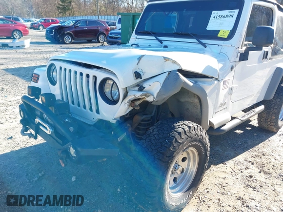 2005 Jeep Wrangler Unlimited with VIN 1J4FA44SX5P316055, listed as a IAAI auction lot 41586898 with 218,181 mi miles. Bid and sale history available at carsss.com. Image 6.