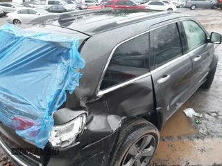 2015 Jeep Grand Cherokee Limited with VIN 1C4RJFBG8FC713253, listed as a IAAI auction lot 41757689 with 129,420 mi miles. Bid and sale history available at carsss.com. Image 4.
