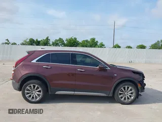2023 Cadillac XT4 FWD Premium Luxury with VIN 1GYFZCR47PF106017, listed as a IAAI auction lot 42283401 with 40,734 mi miles and . Bid and sale history available at DreamBid. Image 13.