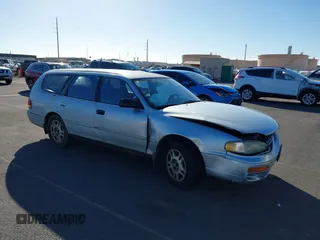1995 Toyota Camry LE z VIN 4T1GK12W1SU100177, wystawiony jako IAAI lot #41338427 z przebiegiem 128 733 mil mil oraz . Historia ofert i sprzedaży dostępna na DreamBid. Obrazek 1.