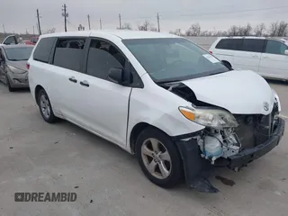 2015 Toyota Sienna L with VIN 5TDZK3DC5FS675095, listed as a IAAI auction lot 41434418 with 124,630 mi miles. Bid and sale history available at carsss.com. Image 1.