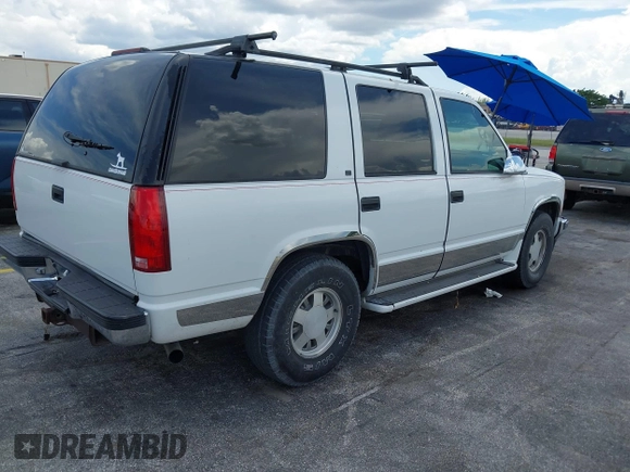 1995 Chevrolet Tahoe with VIN 1GNEC13K9SJ414611, listed as a IAAI auction lot 42798752 with 205,988 mi miles and . Bid and sale history available at DreamBid. Image 4.