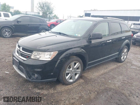 2014 Dodge Journey Limited with VIN 3C4PDDDG4ET141164, listed as a IAAI auction lot 42255057 with 195,135 mi miles and . Bid and sale history available at DreamBid. Image 2.