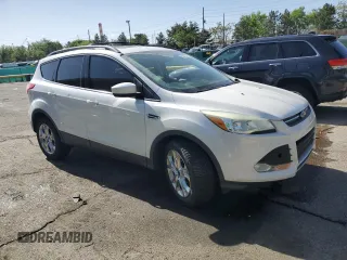 2013 Ford Escape SE z VIN 1FMCU9GX7DUC54856, wystawiony jako Copart lot #54767295 z przebiegiem 130 167 mil mil oraz Szkoda całkowita • Salvage title. Historia ofert i sprzedaży dostępna na DreamBid. Obrazek 4.