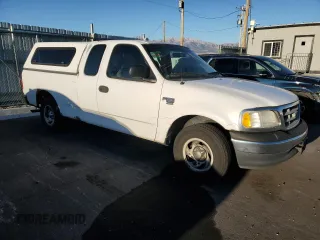 2000 Ford F-150 with VIN 1FTRX17W8YKB11043, listed as a Copart auction lot 77390664 with 181,439 mi miles and Salvage Title. Bid and sale history available at DreamBid. Image 4.