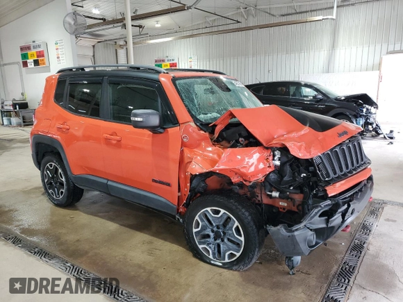 2015 Jeep Renegade Trailhawk with VIN ZACCJBCTXFPB80067, listed as a Copart auction lot 64927985 with Not provided miles and Salvage title. Bid and sale history available at DreamBid. Image 4.