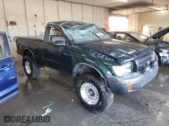 1999 Toyota Tacoma with VIN 4TAPM62N9XZ555738, listed as a Copart auction lot 78293634 with 210,096 mi miles and Salvage Title. Bid and sale history available at DreamBid. Image 4.