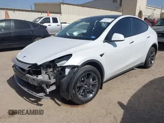 2024 Tesla Model Y with VIN 7SAYGDEDXRA300743, listed as a IAAI auction lot 41690374 with 12,446 mi miles and . Bid and sale history available at DreamBid. Image 2.