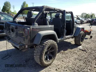 2015 Jeep Wrangler Unlimited Freedom with VIN 1C4BJWDG8FL689194, listed as a Copart auction lot 58016385 with 108,026 mi miles and Salvage title. Bid and sale history available at DreamBid. Image 3.