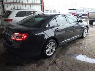 2015 Ford Taurus SEL z VIN 1FAHP2E87FG203272, wystawiony jako IAAI lot #41717231 z przebiegiem 95 829 mil mil oraz . Historia ofert i sprzedaży dostępna na DreamBid. Obrazek 4.