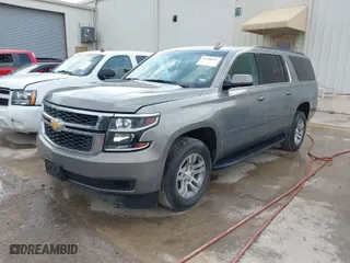 2019 Chevrolet Suburban LT with VIN 1GNSCHKC7KR137304, listed as a IAAI auction lot 41559622 with 100,595 mi miles. Bid and sale history available at carsss.com. Image 2.