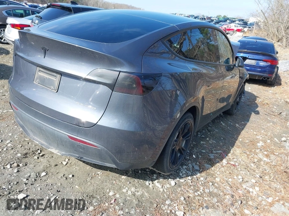2023 Tesla Model Y Long Range with VIN 7SAYGDEE1PA053215, listed as a IAAI auction lot 41476973 with 58,025 mi miles and . Bid and sale history available at DreamBid. Image 4.