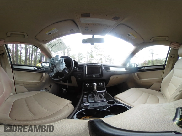 2014 Volkswagen Touareg Sport with VIN WVGEF9BP2ED007904, listed as a IAAI auction lot 41960811 with 126,230 mi miles and . Bid and sale history available at DreamBid. Image 20.