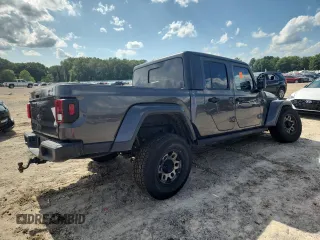 2021 Jeep Gladiator 80th Anniversary с VIN 1C6HJTAG7ML521094, выставлен на аукционе Copart как лот 61276595 с пробегом 68 684 миль миль и Списание • Salvage title. История ставок и продаж доступна на DreamBid. Изображение 3.