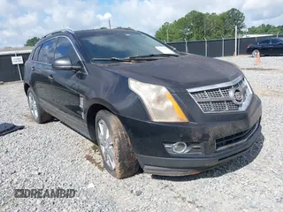 2011 Cadillac SRX Premium Collection z VIN 3GYFNCEY4BS516721, wystawiony jako IAAI lot #42534352 z przebiegiem Nie podano mil oraz . Historia ofert i sprzedaży dostępna na DreamBid. Obrazek 1.