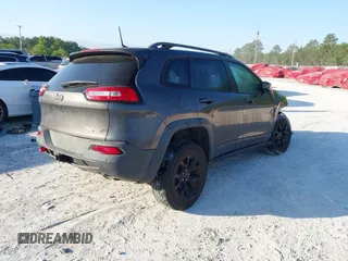 2018 Jeep Cherokee Trailhawk with VIN 1C4PJMBX7JD517299, listed as a IAAI auction lot 42022770 with 62,865 mi miles. Bid and sale history available at carsss.com. Image 4.