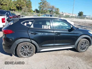 2019 Hyundai Tucson Sport with VIN KM8J33AL5KU902933, listed as a IAAI auction lot 41286316 with 73,799 mi miles. Bid and sale history available at carsss.com. Image 14.