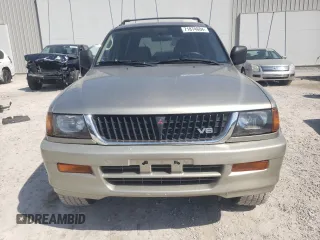 1999 Mitsubishi Montero LS z VIN JA4LS31H8XP026225, wystawiony jako Copart lot #71874604 z przebiegiem 243 182 mil mil oraz Szkody całkowita. Historia ofert i sprzedaży dostępna na DreamBid. Obrazek 5.