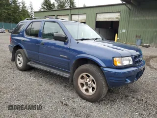 2002 Isuzu Rodeo S with VIN 4S2CK58W124301647, listed as a Copart auction lot 56973895 with 129,009 mi miles and Salvage title. Bid and sale history available at DreamBid. Image 4.