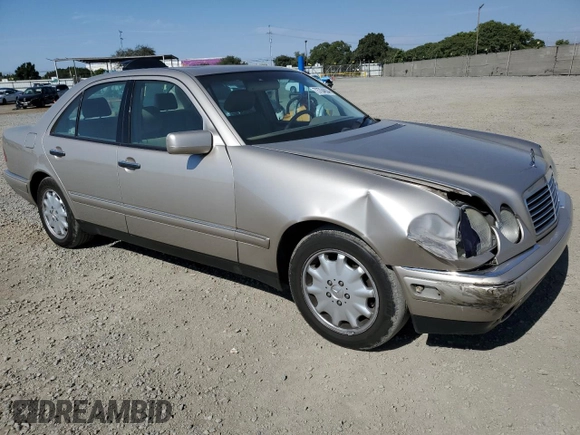 1999 Mercedes-Benz E-Class with VIN WDBJF65H5XA804902, listed as a Copart auction lot 73704634 with 92,411 mi miles and Salvage Title. Bid and sale history available at carsss.com. Image 4.