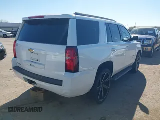 2015 Chevrolet Tahoe LS with VIN 1GNSCAKCXFR748554, listed as a IAAI auction lot 41765865 with 160,282 mi miles and . Bid and sale history available at DreamBid. Image 4.