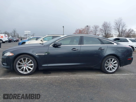 2014 Jaguar XJ with VIN SAJWA1CZ0E8V73966, listed as a IAAI auction lot 41887234 with 120,804 mi miles and . Bid and sale history available at DreamBid. Image 14.