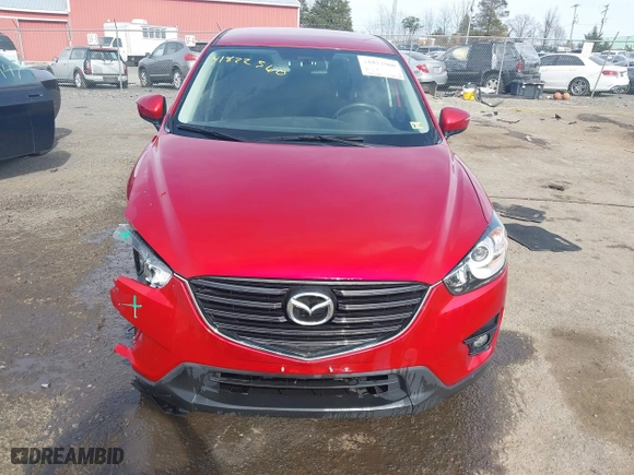 2016 Mazda CX-5 Touring with VIN JM3KE4CY9G0686494, listed as a IAAI auction lot 41822560 with 32,156 mi miles. Bid and sale history available at carsss.com. Image 12.