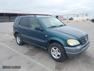 1999 Mercedes-Benz M-Class with VIN 4JGAB54E8XA055359, listed as a IAAI auction lot 41808170 with 161,573 mi miles. Bid and sale history available at carsss.com. Image 1.