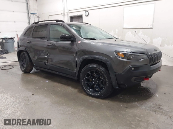 2022 Jeep Cherokee Trailhawk z VIN 1C4PJMBX9ND514703, wystawiony jako IAAI lot #41761037 z przebiegiem 38 499 mil mil oraz . Historia ofert i sprzedaży dostępna na DreamBid. Obrazek 1.
