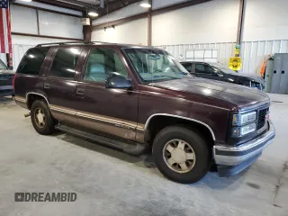1997 GMC Yukon with VIN 1GKEC13R2VJ734299, listed as a Copart auction lot 74988224 with 225,335 mi miles and Salvage Title. Bid and sale history available at carsss.com. Image 4.